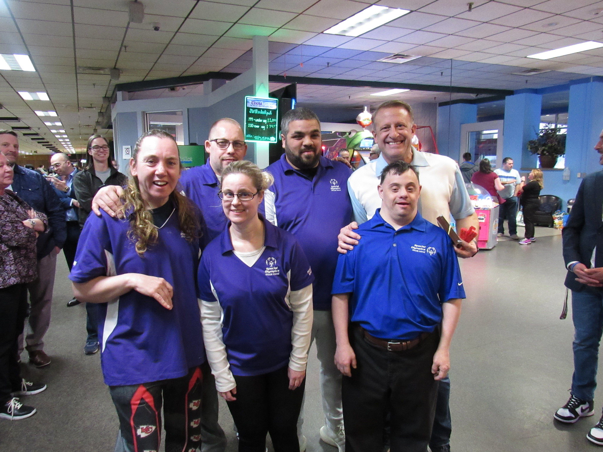 attendees at bowling community event posing for picture