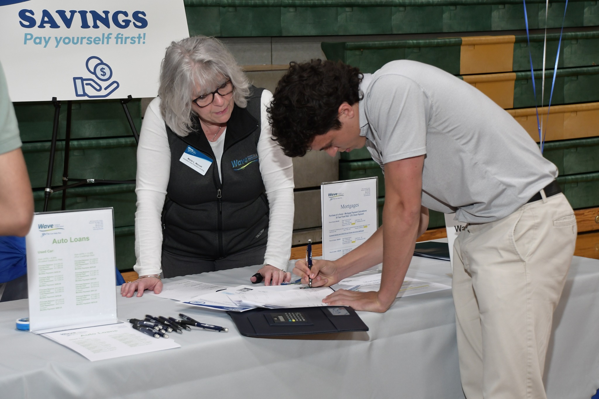 Marie Morrell, AVP Consumer Lending, Wave FCU reviewing savings/budgeting options with student