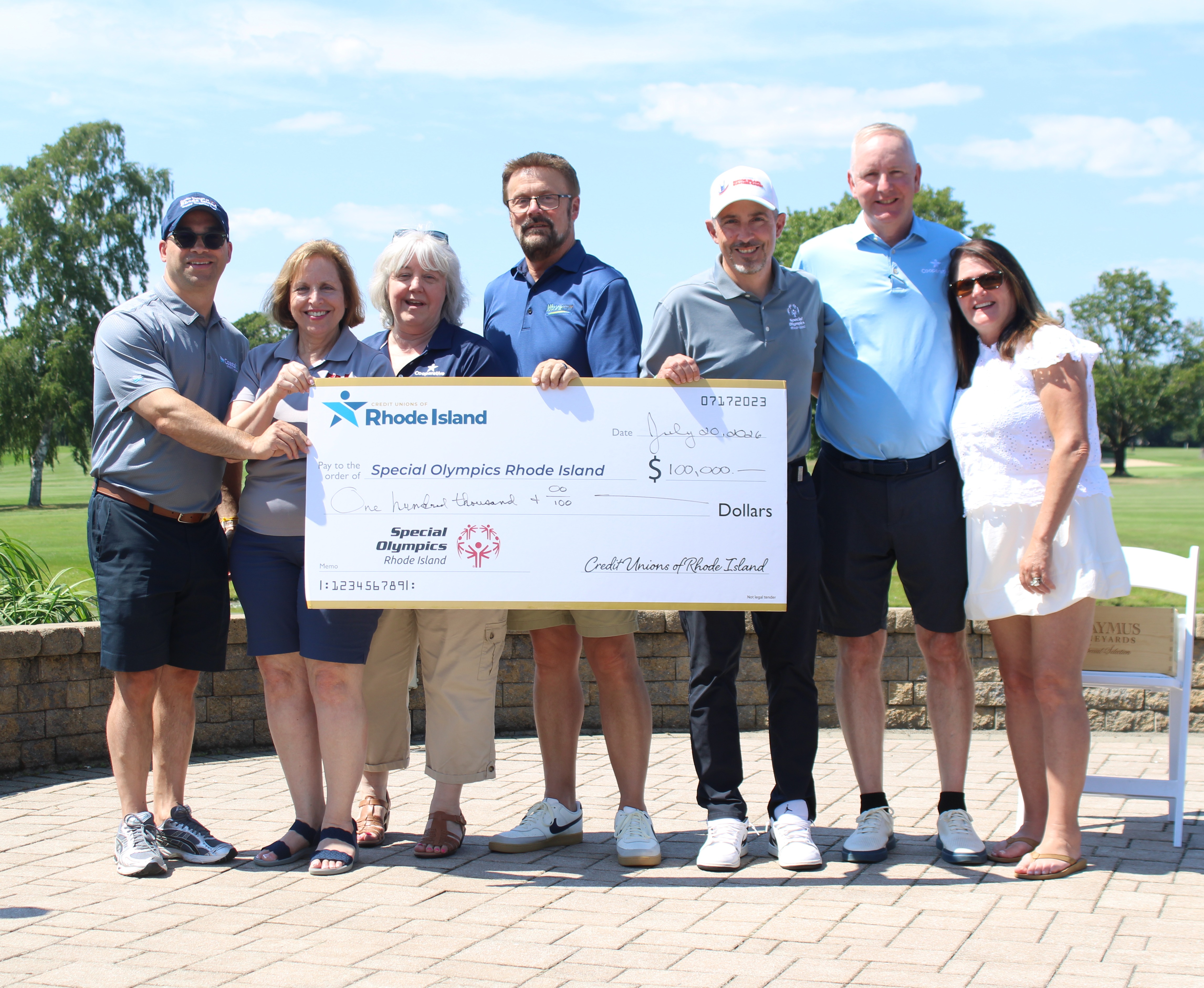 group photo of check presentation