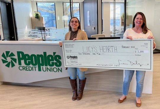 People's Credit Union presents check