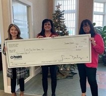 People's CU holding charity check